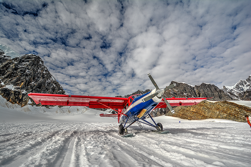 Airplane in remote missions flying in the mountains representig mission aviation